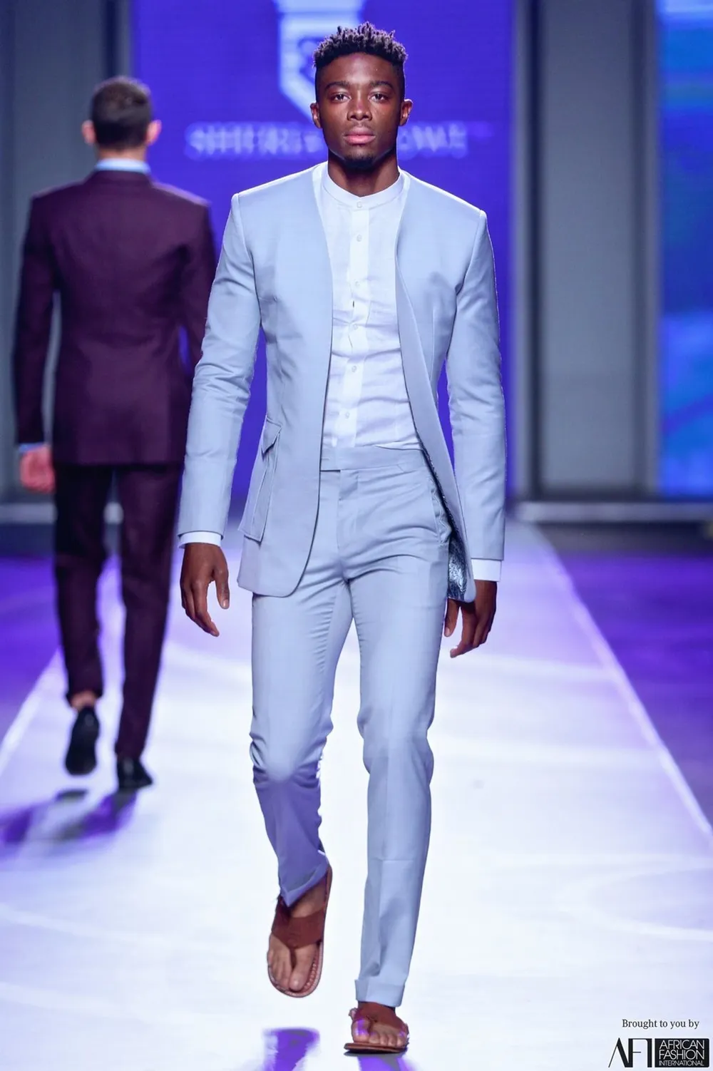 Tino Chinyani modeling on stage.