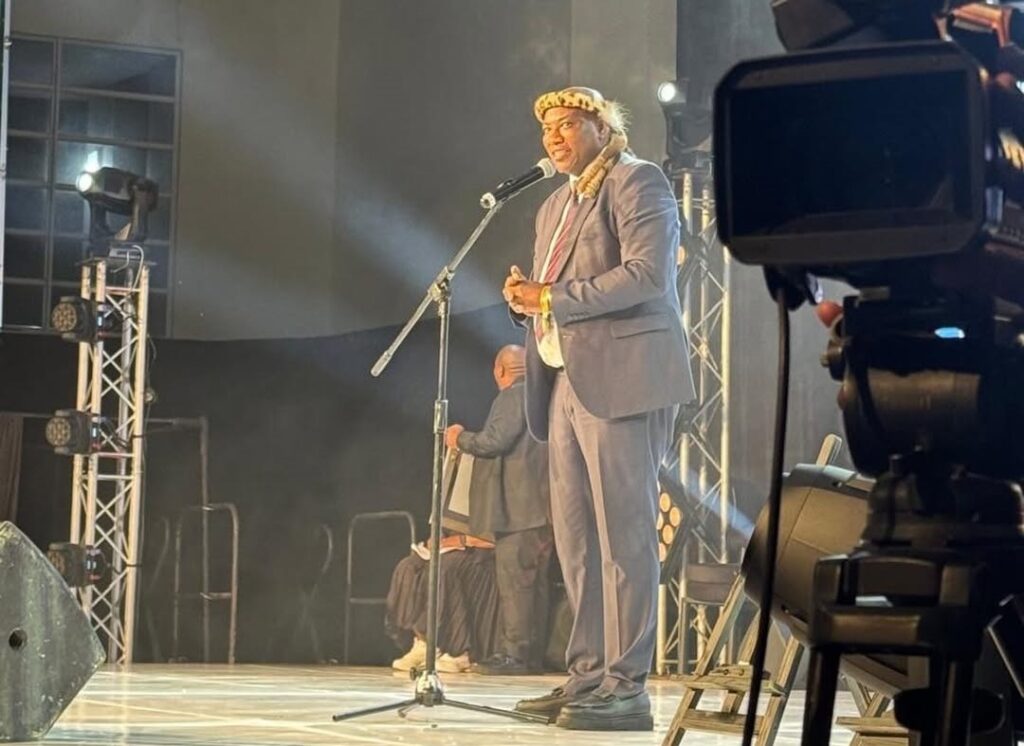 Image of Musa Mseleku giving a speech on stage.