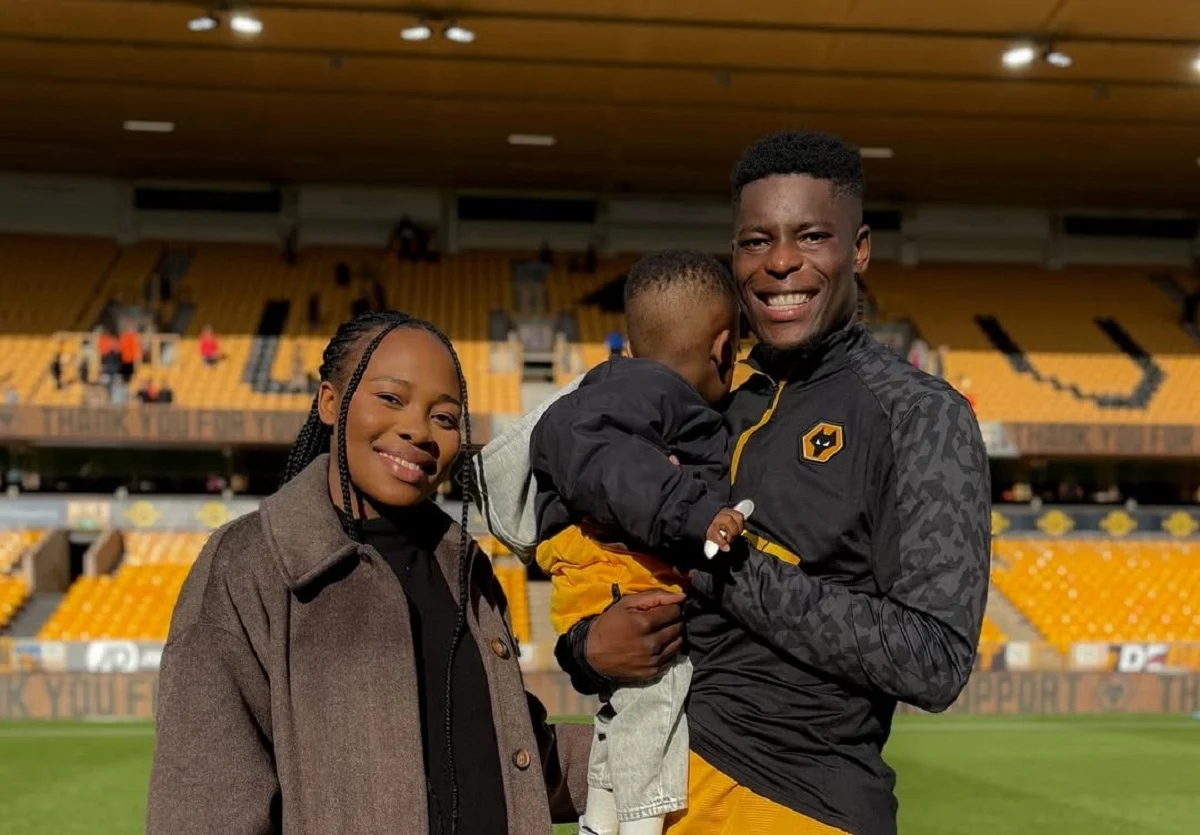 Marshall Munetsi with his wife and child.